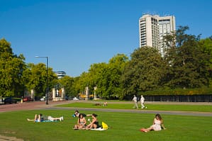 People sunbathing at Hyde Park Corner ce..........