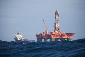 Standby boat departing from oil rig