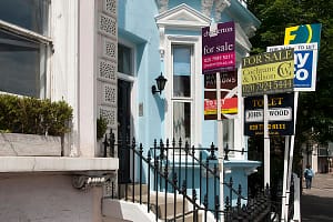 "Letting and estate agent signs outside a property in Chelsea, South West London, UK"