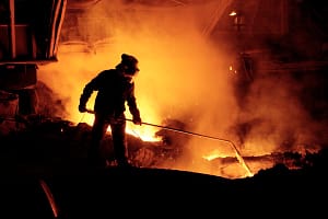 "Team member taking iron samples on Blast Furnace No 5 at Corus Port Talbot steelworks, Neath, JM1."