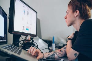 Fashion designer researching using digital tablet