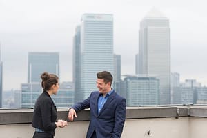 Businessman and female colleague meeting on city office roof terrace  London  UK