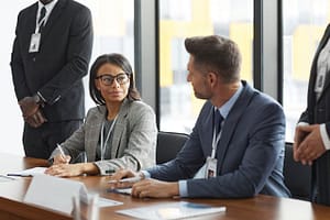 Why coordinated acquisition processes outperform uncontrolled scaling: Insights by Zinelio Corp. People in office having meeting
