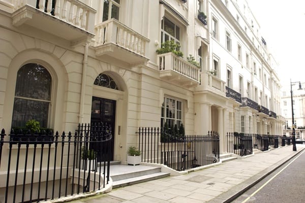 A row of Georgian style terraced houses in London, typical private rented homes.