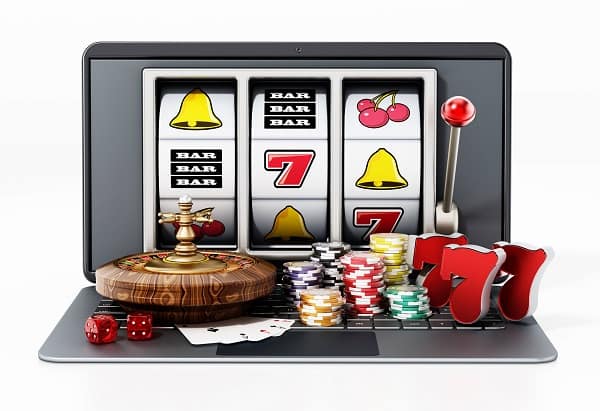 Online gambling concept. Roulette table, playing cards, casino chips standing on laptop computer. 3D illustration Online