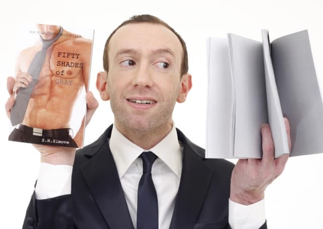 Shed Simove poses with his new book, Fifty Shades of Gray