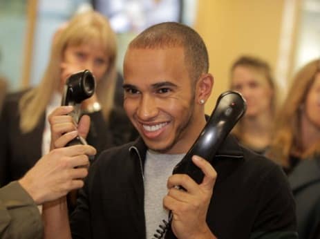 Lewis Hamilton gets on the phones