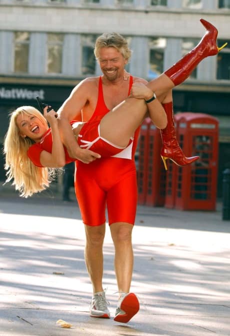 Richard Branson picking up model Maddy Ford