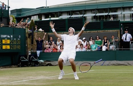 USA's John Isner celebrates victory over France's Nicolas Mahut in their record breaking match on Court 18 during Day Four of the 2010 Wimbledon Championships at the All England Lawn Tennis Club, Wimbledon.