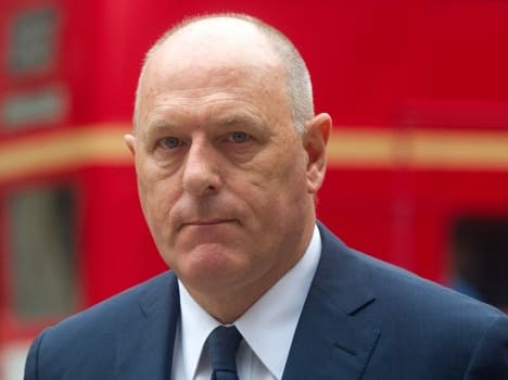 Peter Cruddas leaving court