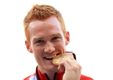 Great Britain's Greg Rutherford receives his gold medal for the mens long jump at the Olympic Stadium, London.
