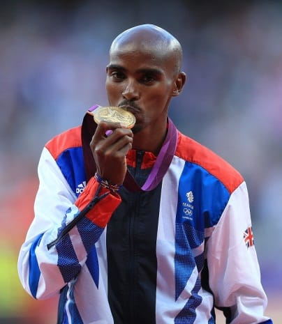 Great Britain's Mo Farah receives his gold medal for the men's 10,000m final at the Olympic Stadium, London.