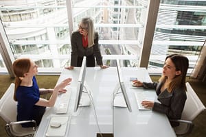 Mentor giving guidance to businesswomen