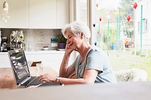 Senior woman sitting at table