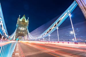 Long exposure of Tower bridge at night with light stripes from traffic