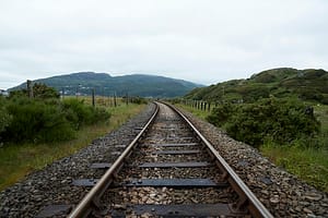 View along a railway track in rural Wales on a cloudy day