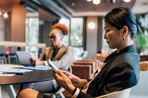Profile of businesswoman using digital tablet in creative studio