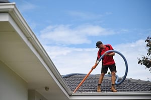 Gutter cleaner cleaning house gutters