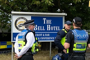 Anti-Immigration + Stand Up To Racism Protestors gather at the Bell Hotel in Epping