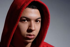young man wearing red hooded sweatshirt