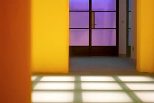 Why premium cladding is the best choice for businesses Modern interior showing underfloor lighting.