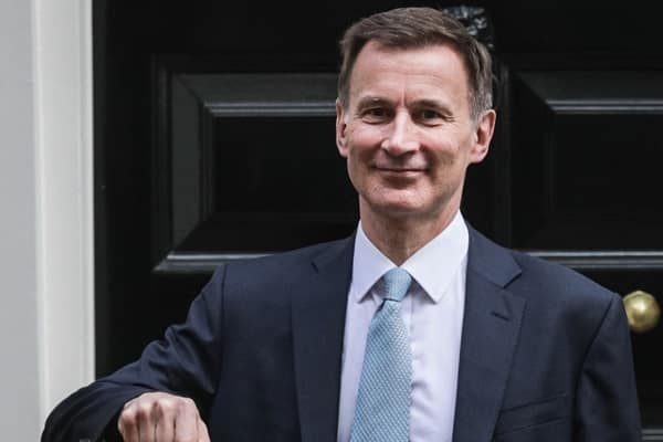 Chancellor Jeremy Hunt with the red budget box in Downing Street, London, UK