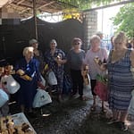 Under the trees, under fire: Kherson families’ desperate fight to bring food home