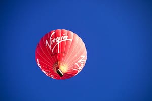 A Virgin hot air balloon floating over the Yorkshire Dales.