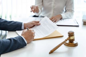 Lawyer Legal counsel presents to the client a signed contract with gavel and legal law. justice and lawyer Business part