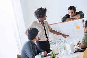 Colleagues discussing ideas in office