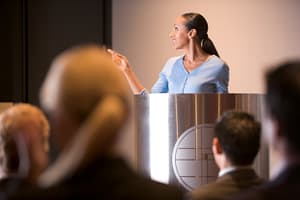 The subtle art of persuasion in presentations Businesswoman giving presentation at podium
