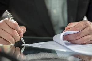 Businessman’s hand signing contract