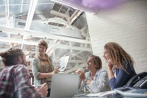 Woman making presentation at meeting in creative studio