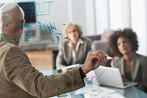 Businessman drawing graph in meeting