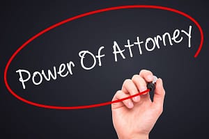 Man Hand writing Power Of Attorney with black marker on visual screen Man Hand writing Power Of Attorney with black mark