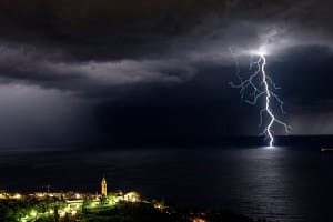 Branched lightning and church in front of Rapallo and near Portofino in Liguria,