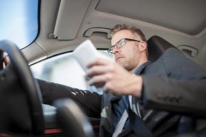 Businessman driving car