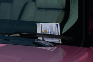 Katie Price gets a parking ticket upon leaving the Mayfair Hotel in London