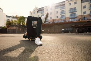 Young man laying on skateboard  relaxing  Bristol  UK
