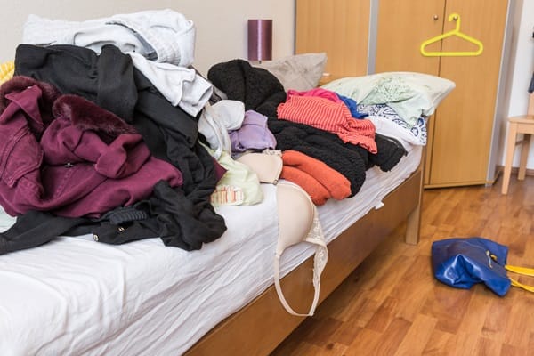 Optimal end of tenancy cleaning tips for businesses Messy teenager room. Untidy cluttered bed Messy teenager room. Untidy cluttered bed, dirty clothes. Compulsive Hoarding